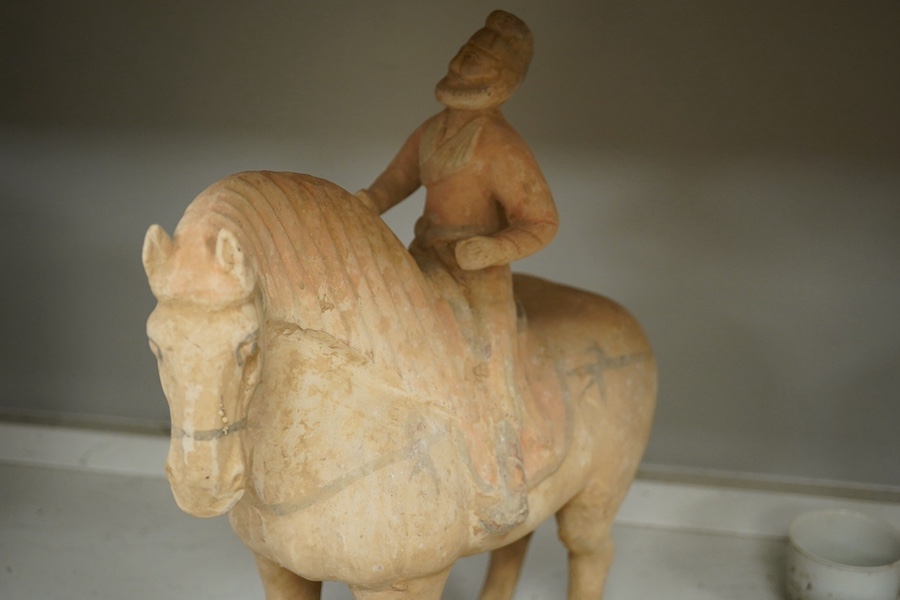 A group of antiquities- pottery and coins, including a later white glazed cup. Tallest 39cm high. Condition - fair to good considering age.